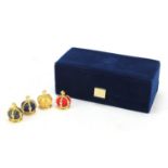 Set of four Fabergé Collection menu holders housed in a fitted silk and velvet lined case, each menu