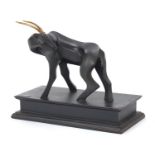 Modernist patinated bronze study of a stylised gazelle raised on a rectangular block base with