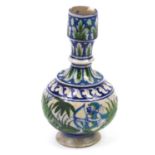 Persian Iznik pottery vase hand painted with two huntsmen and wild animals, 17cm high