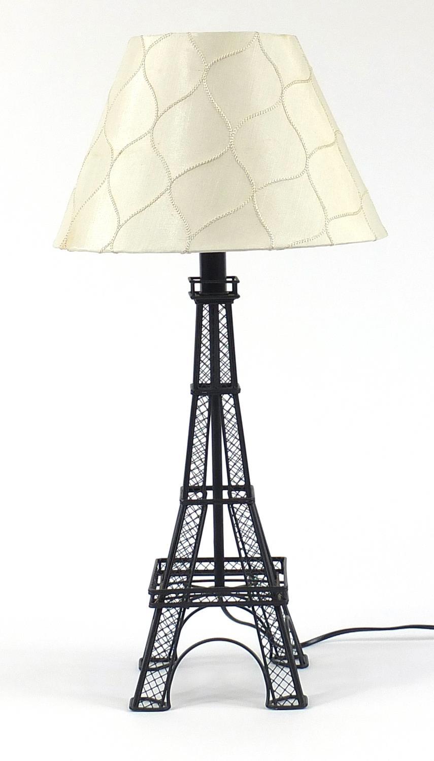 Black metal table lamp in the form of the Eiffel Tower, 61cm high