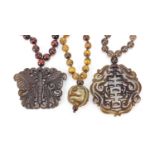 Three Chinese carved hardstone pendant bead necklaces, the largest 42cm in length, total 183.0g