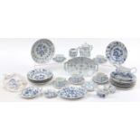 Meissen style Blue Onion pattern china including plates, gravy boat and cups with saucers, the