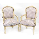 Pair of French style cream painted open armchairs with check upholstery and serpentine front, 95cm