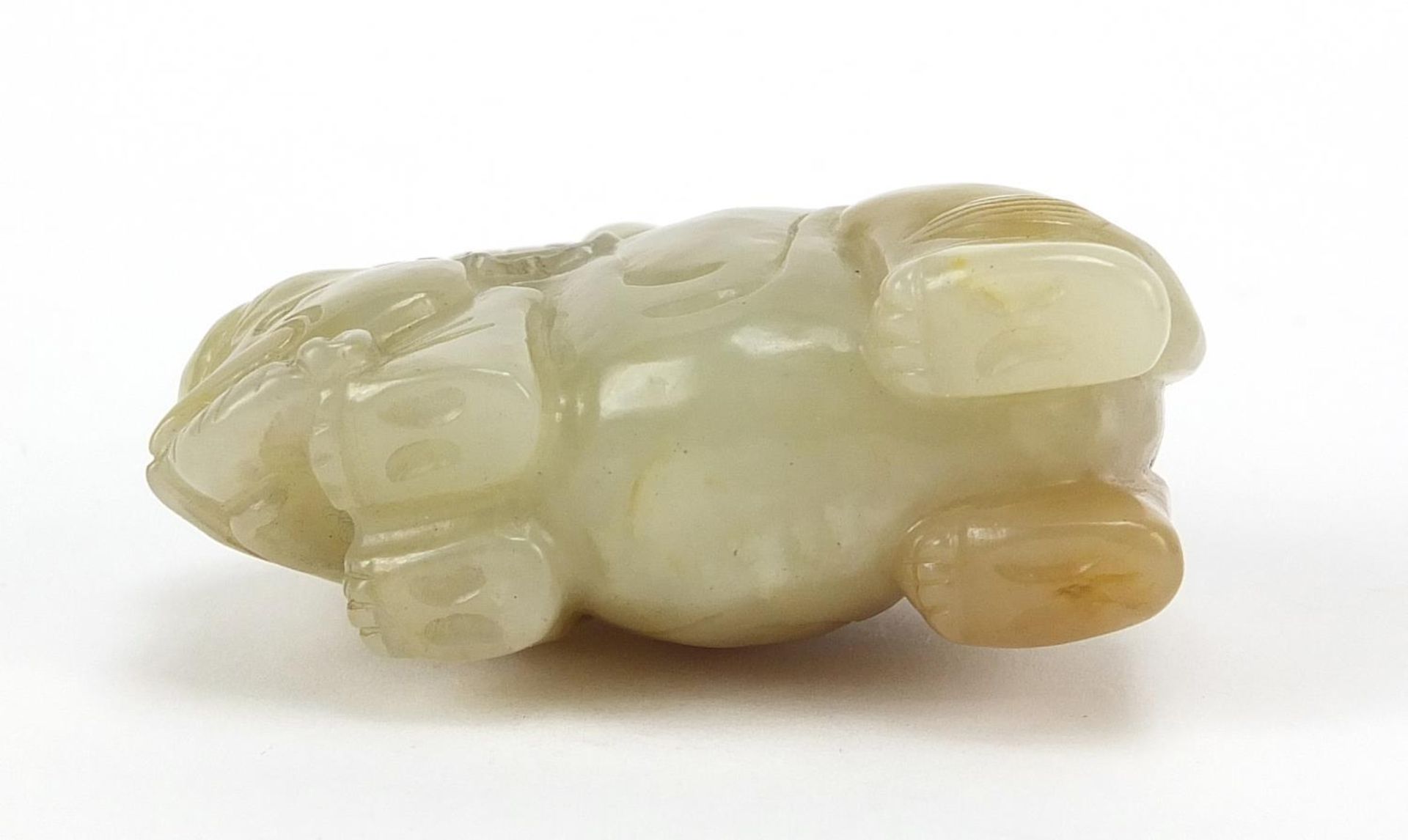 Chinese celadon and russet jade carving of a boy holding a ruyi sceptre on elephant, 6.5cm wide - Image 7 of 7