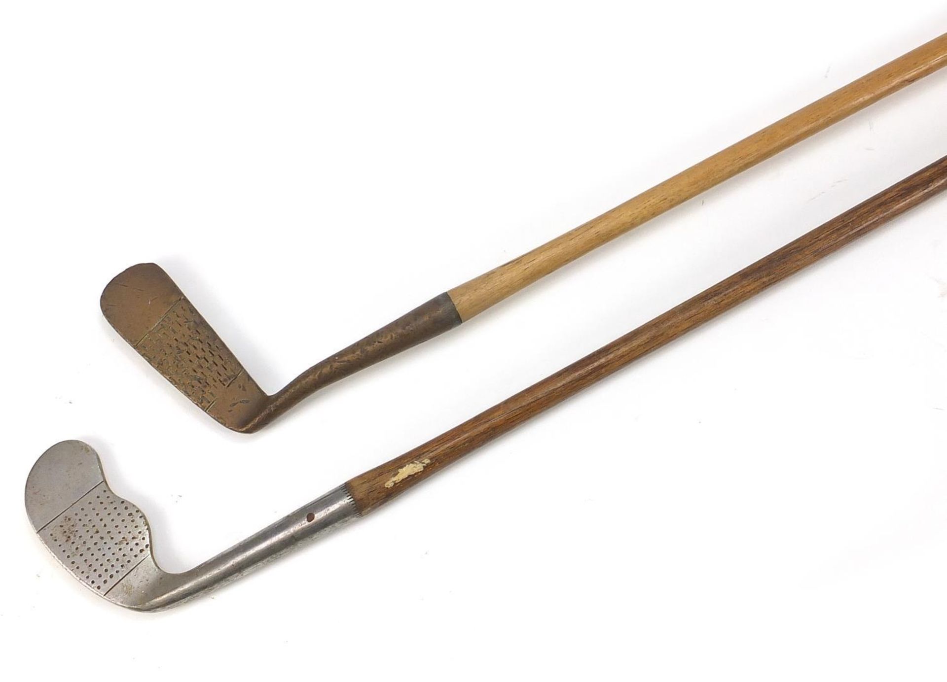 Two vintage wooden shafted aluminium headed putters comprising A Toole & Sons Special Suitall putter