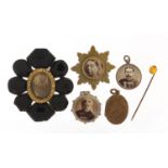 Antique jewellery including jet brooch and silver aesthetic locket with bevelled glass, the