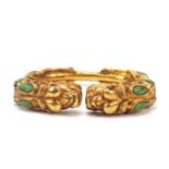 Tibetan gilt metal dragon bangle, 8cm wide