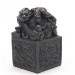 Large Chinese patinated bronze dragon and tortoise design seal with character marks to the base,