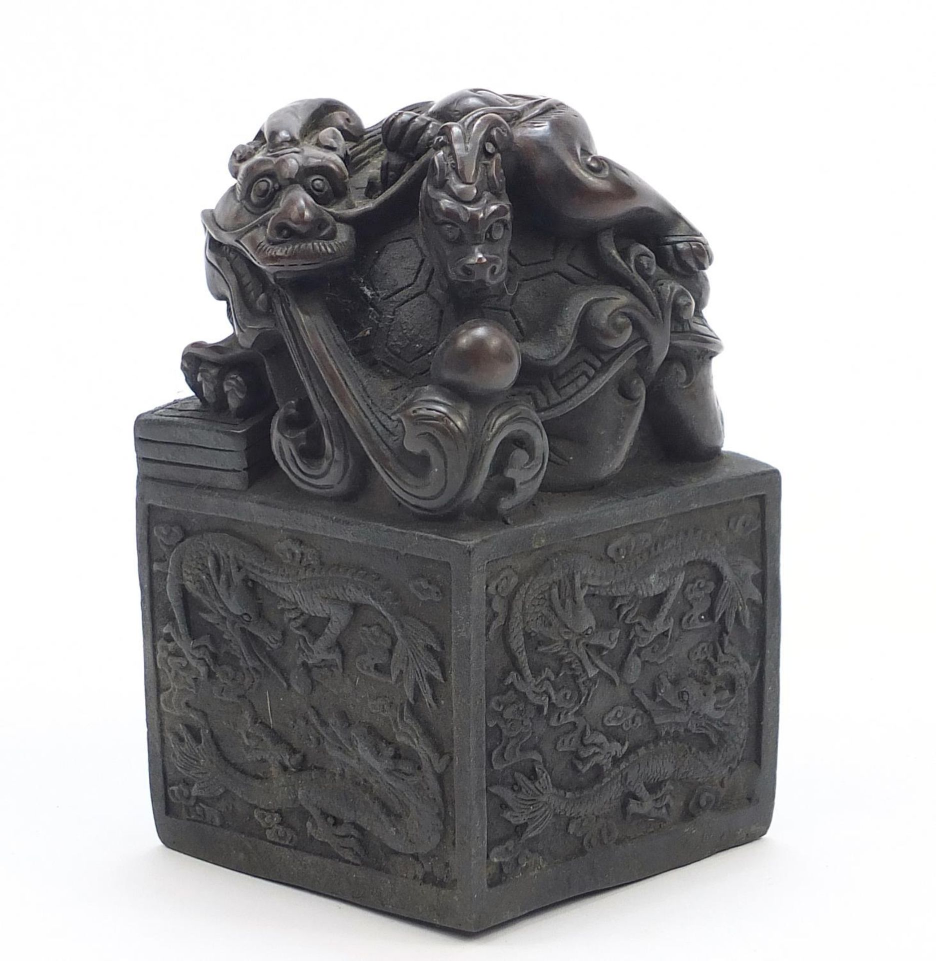 Large Chinese patinated bronze dragon and tortoise design seal with character marks to the base,