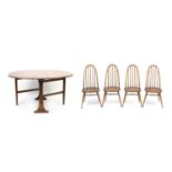 Ercol drop leaf dining table with four stick back chairs, the table 71cm H x 140cm W extended x