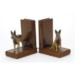 Pair of hardwood book design bookends, each mounted with a cold painted Alsatian, each 13cm high
