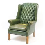 Green leather Chesterfield armchair with button back upholstery, 105cm high
