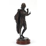 Patinated bronzed figure of Shakespeare raised on a circular hardwood base, 35cm high