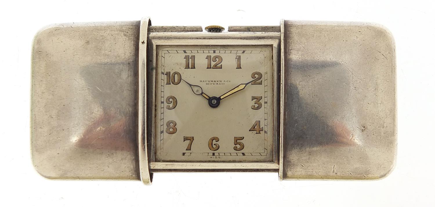 Movado, Art Deco silver self winding travel watch, retailed by Hausmann & Co, the case numbered