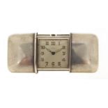 Movado, Art Deco silver self winding travel watch, retailed by Hausmann & Co, the case numbered