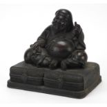 Large Chinese patinated figure of Buddha with calligraphy, 24cm wide