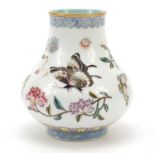 Chinese porcelain baluster vase, finely hand painted in the famille rose palette with butterflies
