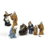 Seven Chinese mud men pottery figures, the largest 22cm high