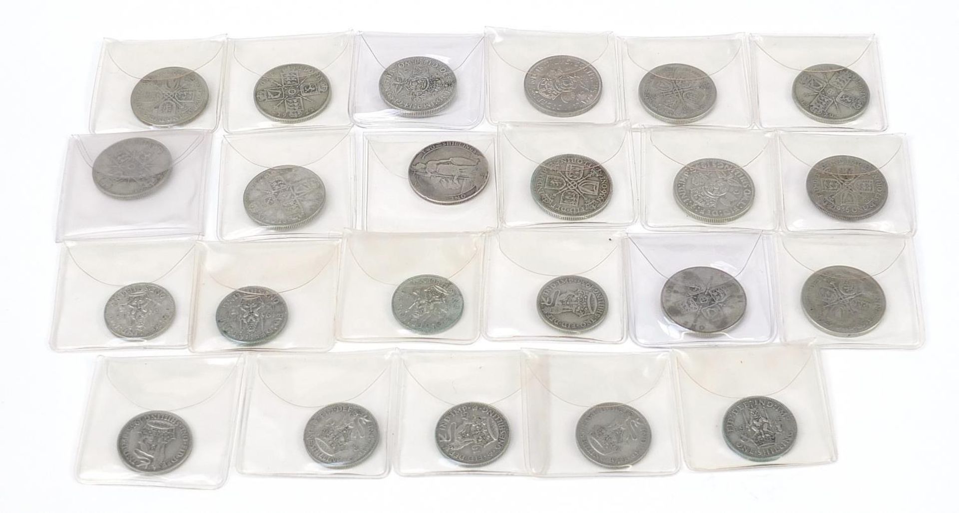 Collection of British pre 1947 shillings and florins, 230g (with plastic sleeves)