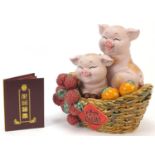 Chinese porcelain sculpture of two piglets in a basket with certificate, 30cm high