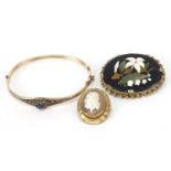 Antique jewellery comprising a pietra dura brooch, cameo brooch and a black and clear sapphire