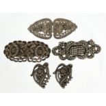 Four silver coloured metal marcasite two piece clips, the largest 5.5cm wide