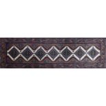 Rectangular Persian patterned carpet runner, 280cm x 82.5cm