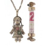 Silver rag doll pendant on a silver necklace and a novelty silver money cracker, the pendant 6cm
