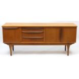 Vintage teak sideboard fitted with three drawers, a pair of cupboard doors and a fall, 76.5cm H x