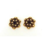 Pair of 9ct gold garnet cluster stud earrings, 8mm in diameter, 1.3g