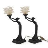 Pair of Art Nouveau style maiden design table lamps each with frosted frilled glass shades, 44cm