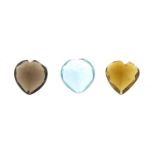 Three love heart gemstones, comprising smoky quartz, tourmaline and Swiss blue topaz, each