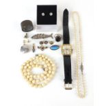 Antique and later jewellery including a silver articulated fish pendant, ivory bead necklace,