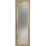 Rectangular gilt framed wall mirror with bevelled glass, 136cm x 44cm