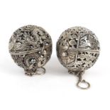 Two Chinese silver coloured metal gimbal incense burners, each approximately 5.5cm in diameter