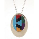 Tom Lewis, Native American Navajo sterling silver, enamel and malachite pendant brooch on a silver