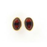 Pair of 9ct gold garnet stud earrings, 6.5mm high, 0.5g