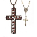 Large silver coloured metal cross pendant on a silver necklace and mother of pearl rosary bead