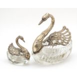 Two German silver and cut glass swan table salts, impressed marks to the wings, 12cm and 7cm high
