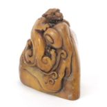 Chinese russet stone seal carved with a water dragon, character marks to the base, 6.5cm high