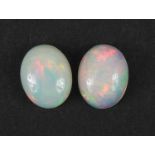Two Ethiopian opal cabochons, each 10mm x 8mm, approximately 3.0 carat in total