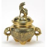 Chinese bronze tripod incense burner with pierced lid and elephant head handles, cast with figures