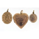 Large gold front and back love heart locket and two other lockets, the largest 3.6cm high, total
