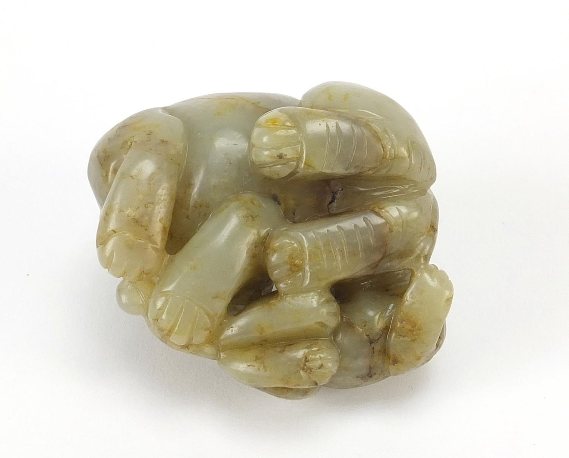 Chinese celadon and russet jade carving of two mythical lions, 6cm wide - Image 6 of 6