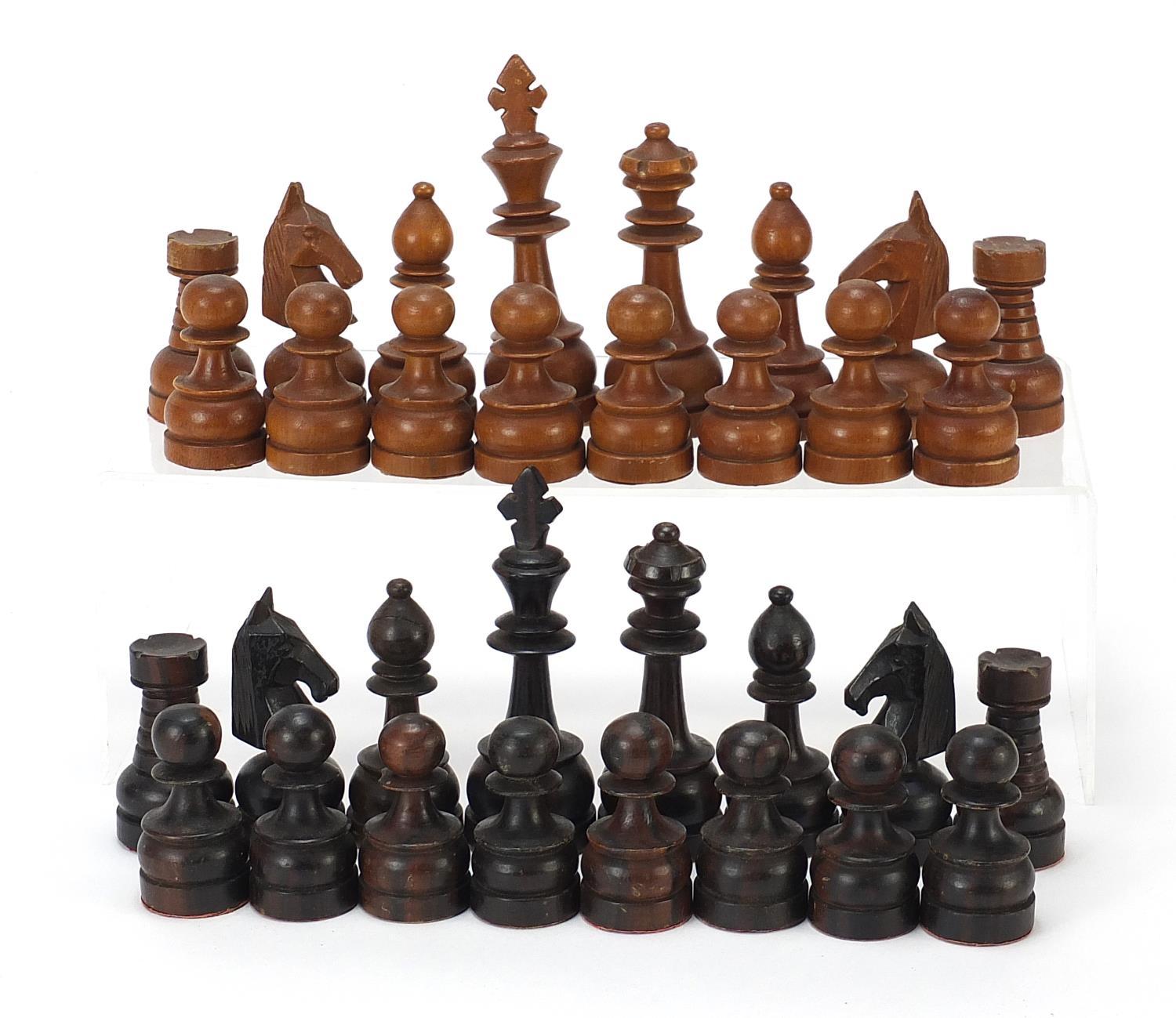 Large carved hardwood chess set, the largest pieces each 12cm high