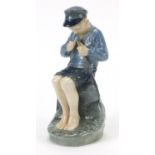 Royal Copenhagen, Danish figure of a boy whittling a stick, numbered 905, 19cm high