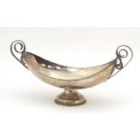 Continental silver pedestal dish with twin handles, impressed marks to the interior, 24cm wide,