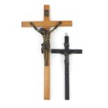 Two religious crucifixes each with applied bronzed Christ, the largest 50cm high