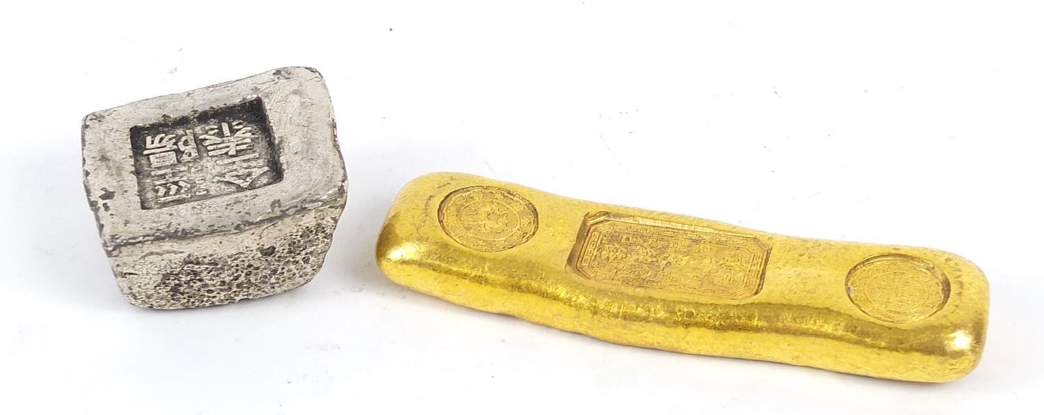 Two Chinese metal ingots, the largest 9cm wide