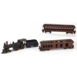Wilkins painted cast iron 0 gauge model railway American railroad locomotive, two carriages and a